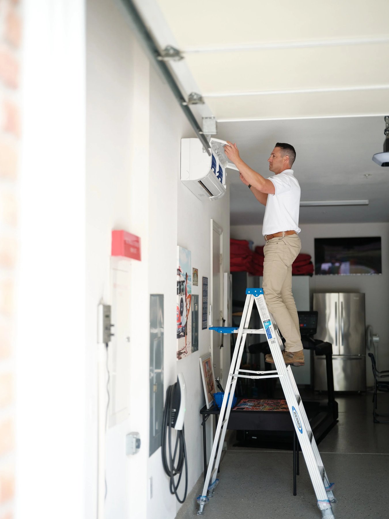 HVAC technician installing a ductless air-conditioning unit