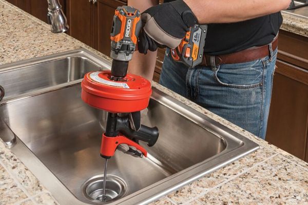 Man Unclog Kitchen Sink